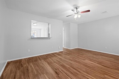Spare room with wood finished floors, a ceiling f