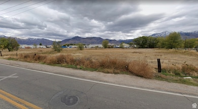 Property view of mountains with a rural view