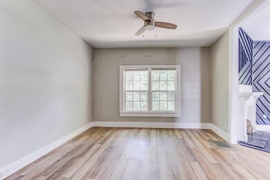 Unfurnished room with light wood-type flooring and ceiling fan