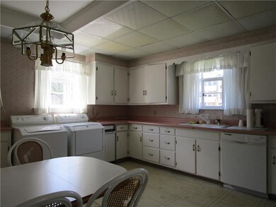 Another view of the kitchen which also includes wa