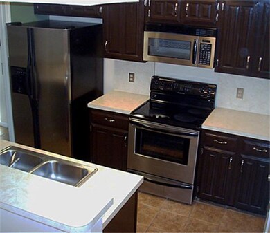 Updated kitchen with stainless steel appliances.
