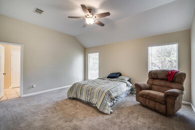 Carpeted bedroom featuring vaulted ceiling, ceilin