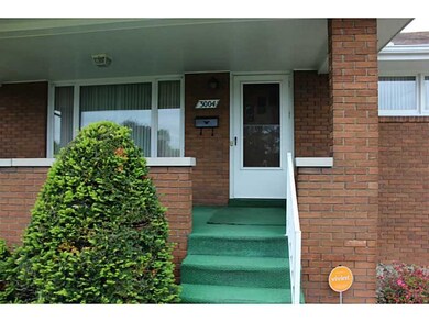 Exterior Front. Front porch overlooks quiet street