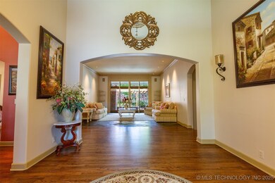 Grand front entry has 20 foot ceilings. Formal din