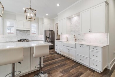The drawers on either side of the farmhouse sink a