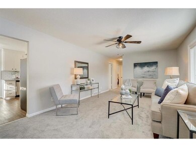 Expansive sun-filled living room offers a picture 