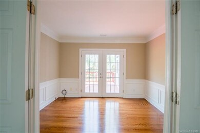 Den or office with french doors leading to Deck