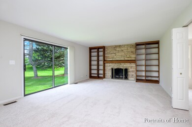Warm & welcoming family room. Stone fireplace with