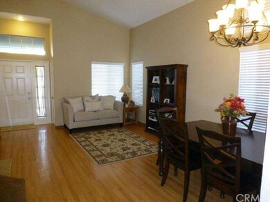 Living Room With Cathedral Ceilings, Laminate Floo