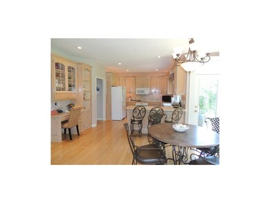 Breakfast room features a built in desk and book c