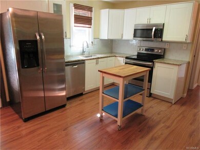 Eat-in Kitchen features Wood Laminate Flooring, Gr
