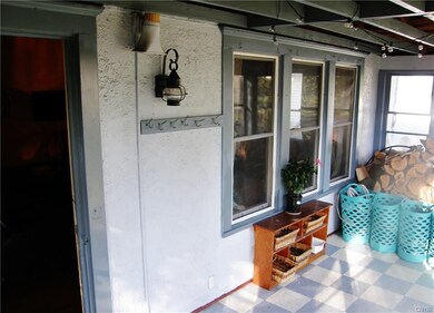 Enclosed front porch.