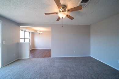 Unfurnished room featuring ceiling fan with notabl