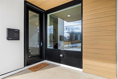 Modern entry with huge picture window which floods