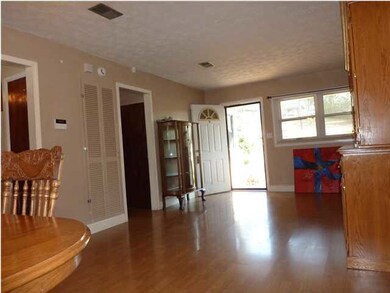Living room, seen from dining room. First door on 