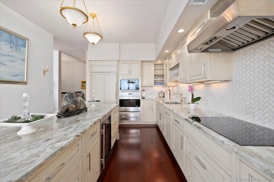 State of the art chef's kitchen with top of the line appliances, cabinetry and stone countertops, is a perfect space for entertaining with these amazing views and access to the private rooftop terrace