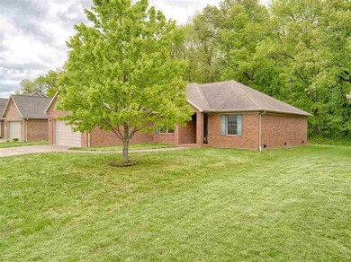 Spacious yard extends to the open rear landscape