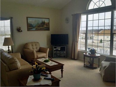 Living Room. Neutral carpet with lots of natural l