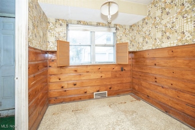 Spare room featuring tile patterned floors