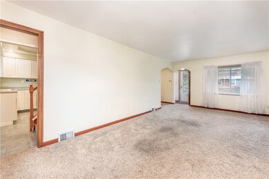 The second level staircase is located in the back of the house.