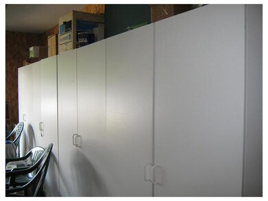 Parking Lot/Garage. SZtorage cabinets line one wal