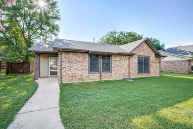 Ranch-style house with a front yard