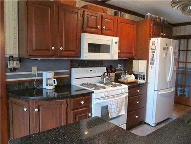 Kitchen. Cherry cupboards, granite countertops, an