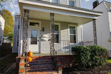 View of exterior entry with covered porch