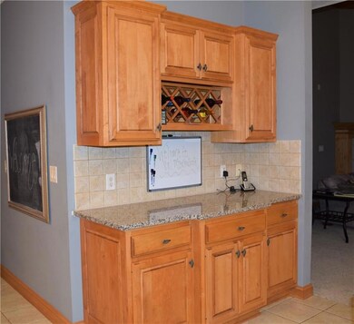 Beverage center next to eat-in kitchen area