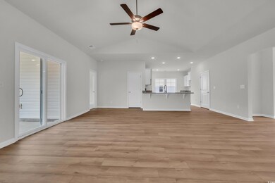 Unfurnished living room with visible vents, lofted