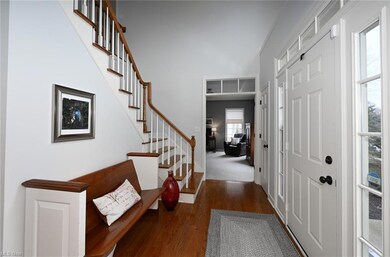Grand Two-Story Foyer with Hardwood Flooring
