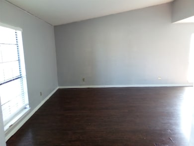 Living room with wood-style floors and ceiling fan