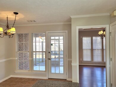 Kitchen overlooks screened in porch