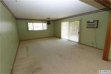 Family room with sliding door to the backyard