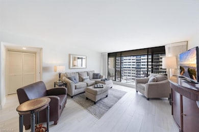 Living area featuring a wall of windows