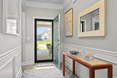 Doorway to outside featuring hardwood / wood-style