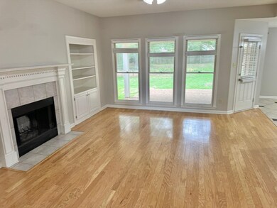 Unfurnished living room with a fireplace, built in