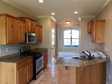 Granite Kitchen with stainless appliances.