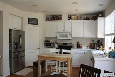 Another view of the kitchen showing portable islan