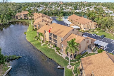 Drone / aerial view of a large body of water and a tree filled landscape
