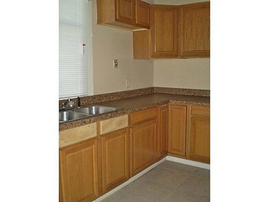 Kitchen. Nice wood cabinets in kitchen; needs appl