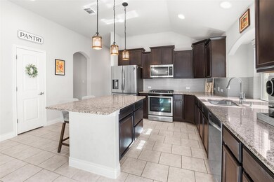 Kitchen featuring appliances with stainless steel