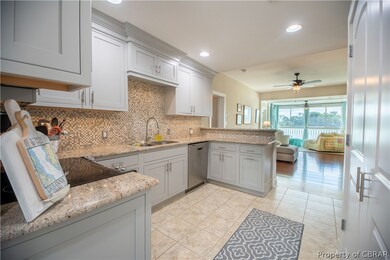 Kitchen featuring light tile patterned floors, kit