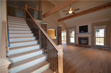 Great Room with gas logs and solid oak hardwood flooring.