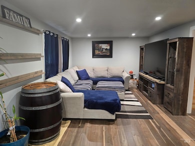 Living room featuring hardwood / wood-style floors and recessed lighting