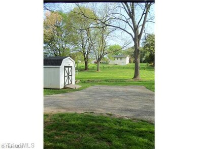 Exterior Back. Back yard with storage building. New survey in 2010