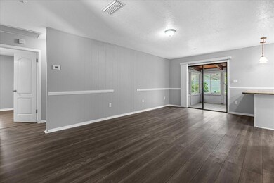 Living room looking into bonus room