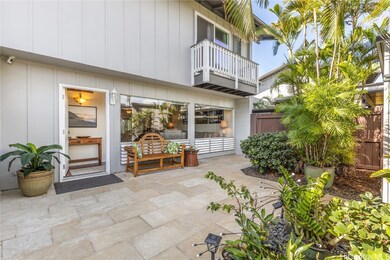 Large front courtyard covered with natural flagsto