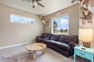Spacious living room with high ceilings and plenty