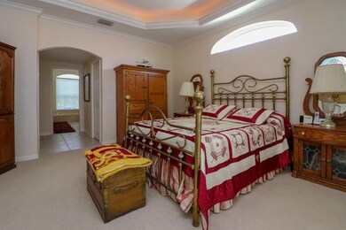 Master bedroom with private entrance to pool area.